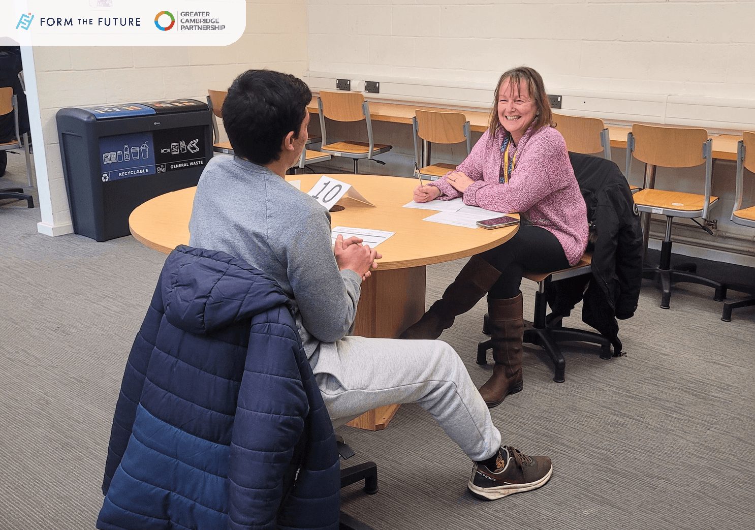 Photo from the mock interview event showing students at tables being interviewed