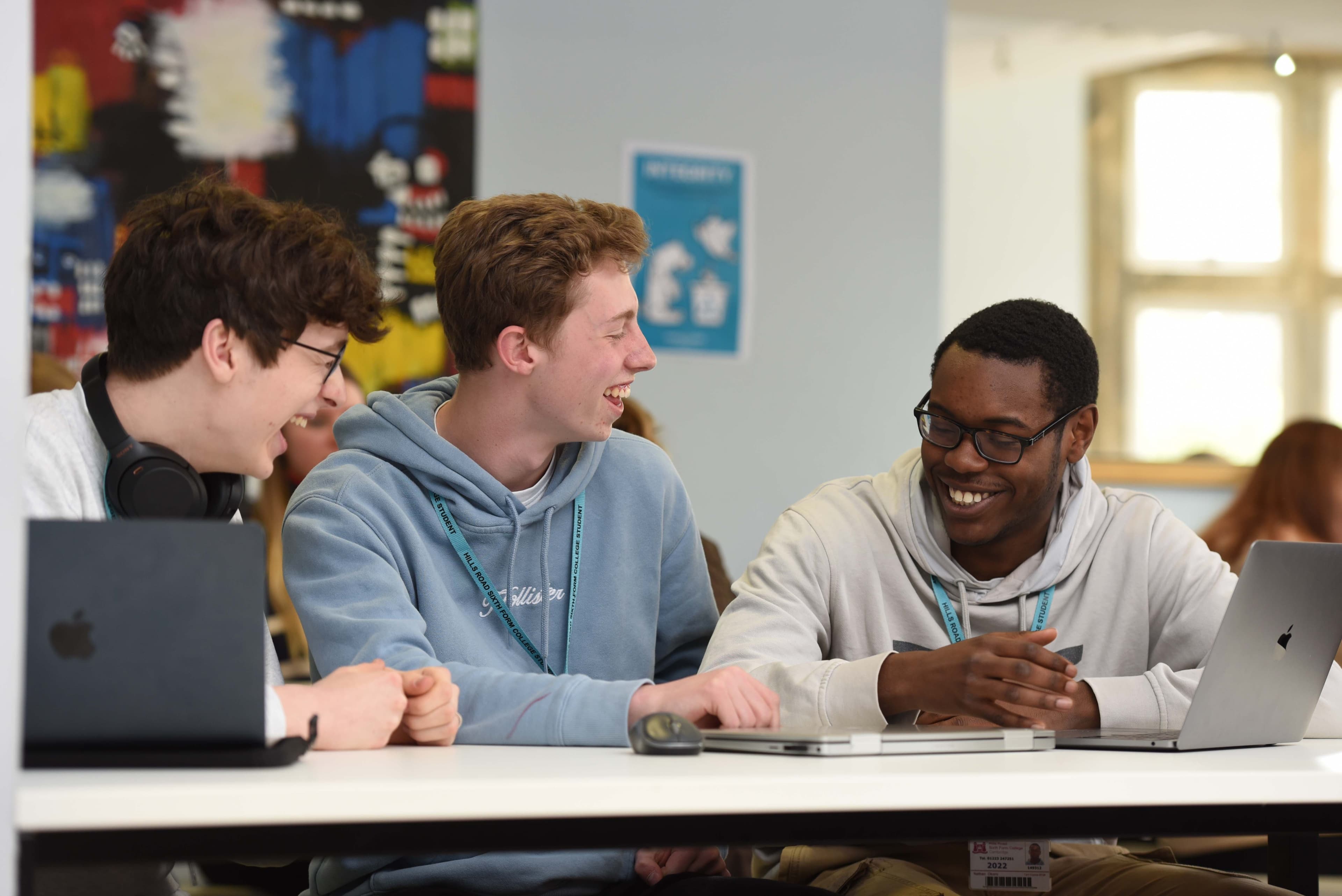 Students laughing whilst studying