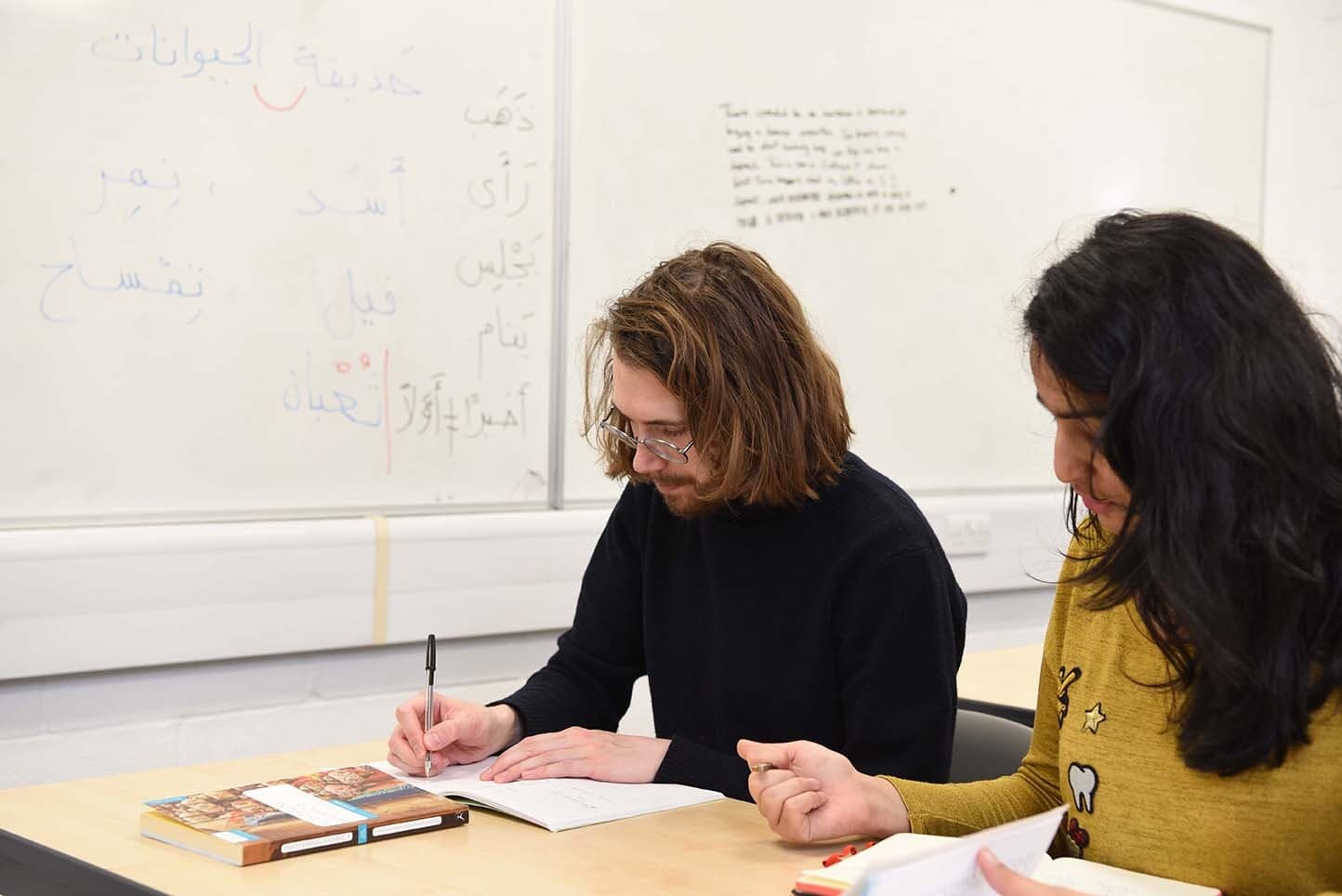 Students in class learning Arabic