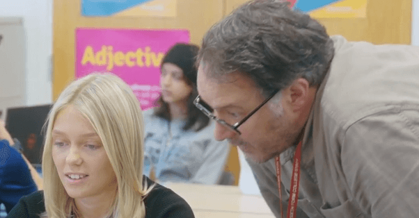 Teacher helping student