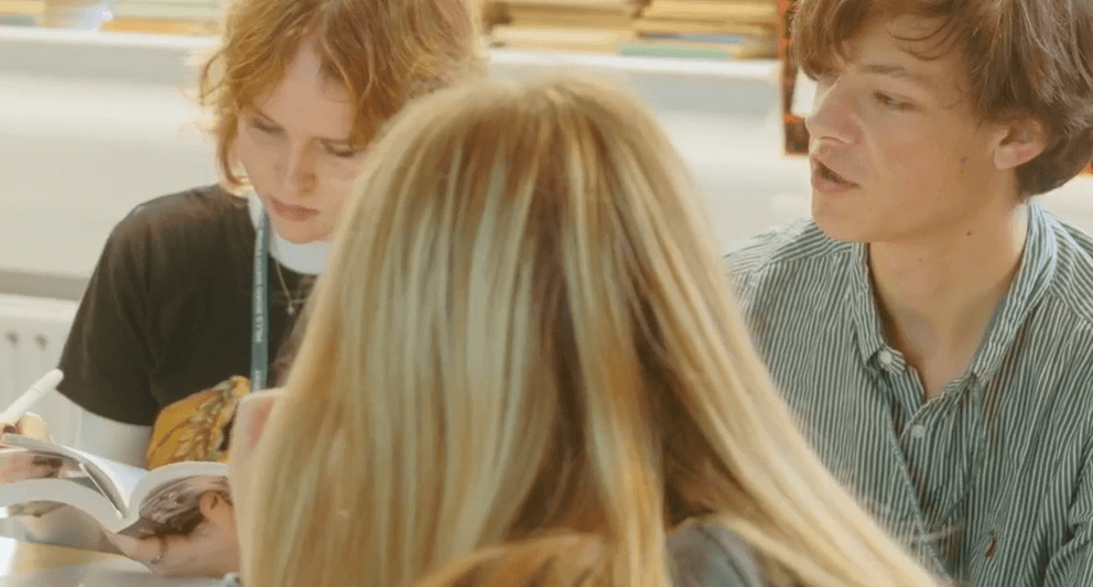 Students discussing book