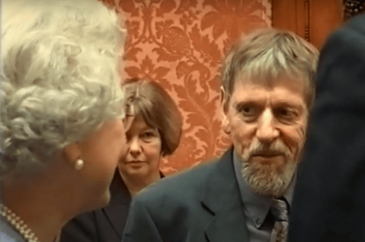 Ted with Elizabeth II at the Palace in 2002