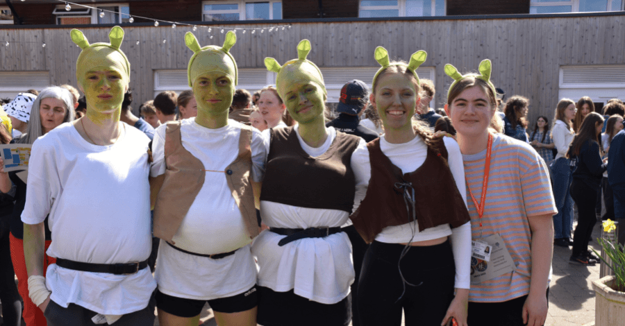 four students dressed up as shrek for HR 4.5 fun run 2025