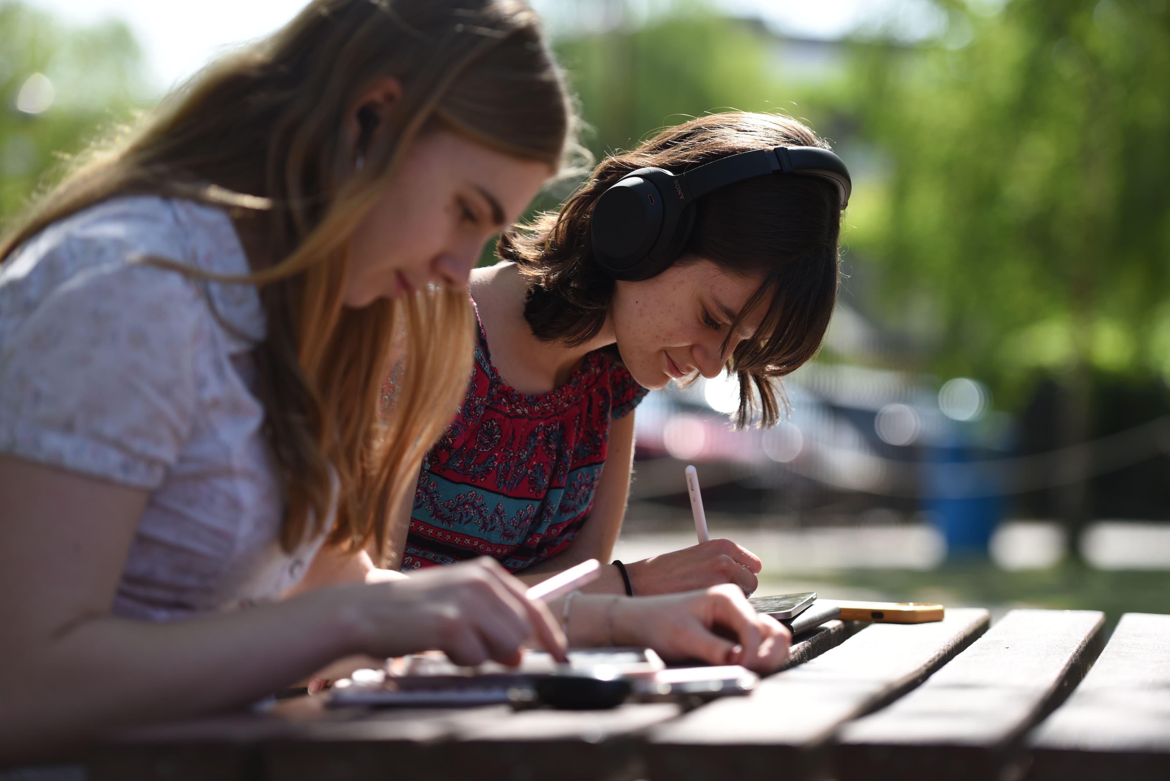 Students writing outside