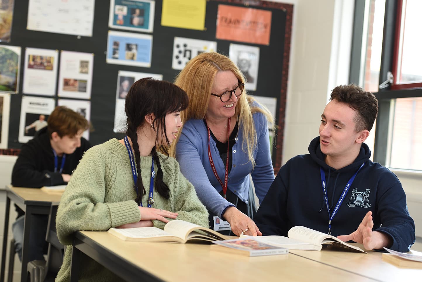 two students and one teacher in classroom