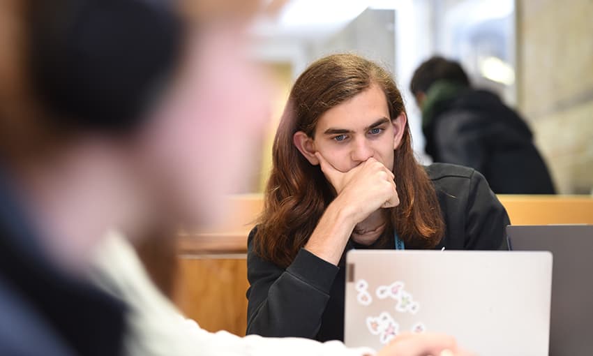 student working on a laptop