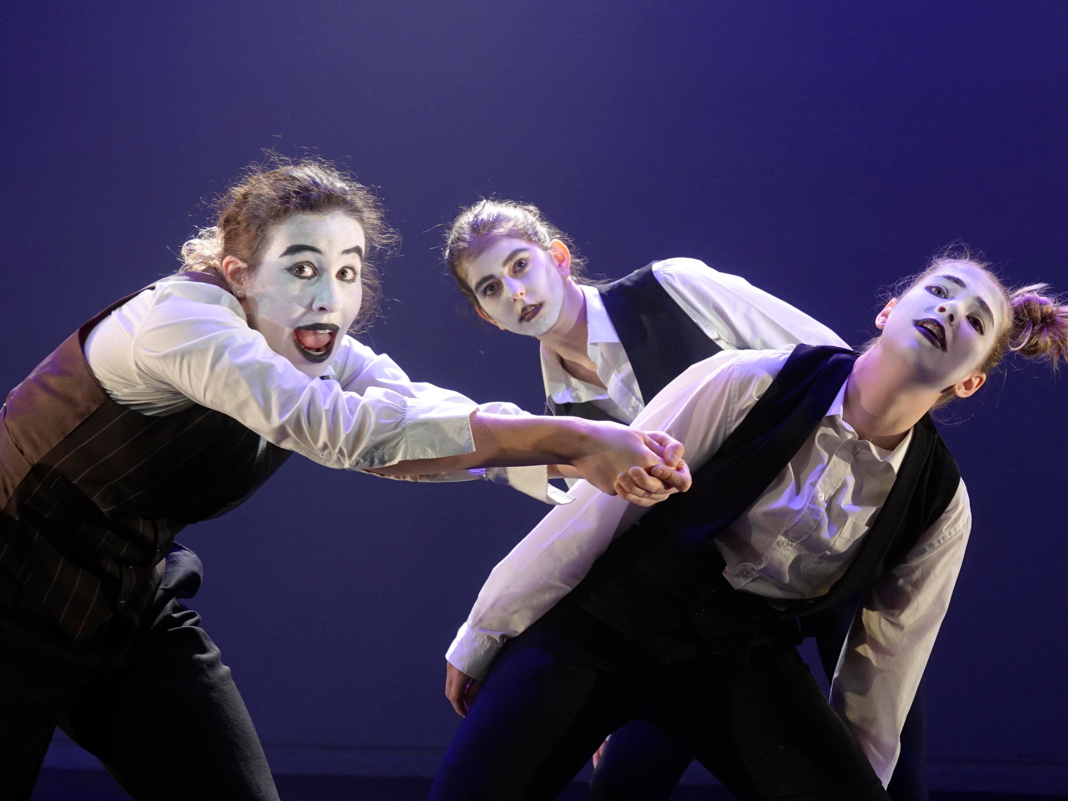 Students performing with face paint