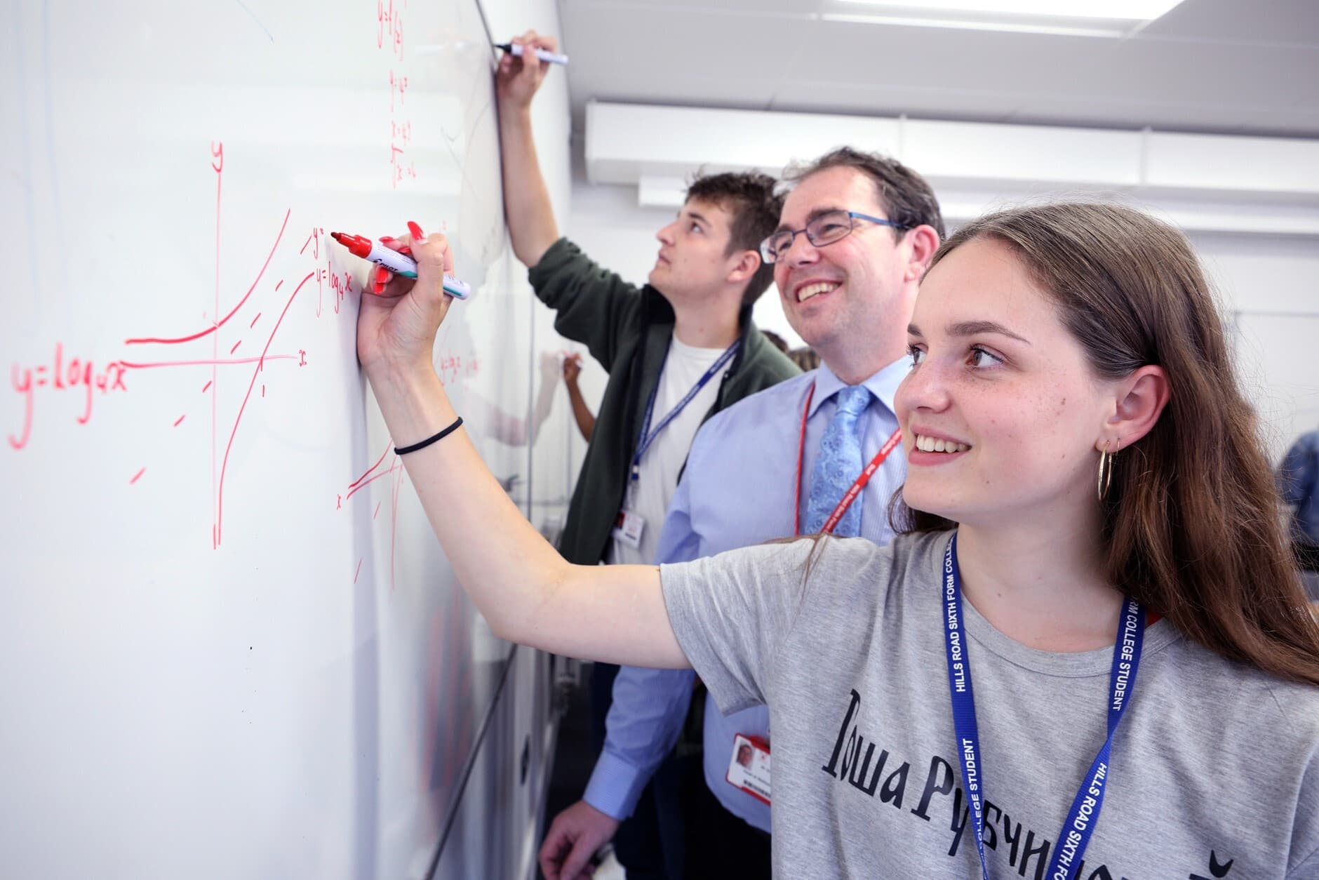 Student writing on board